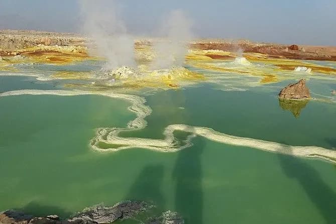 One of Earth's most extreme environments - the hottest inhabited place on Earth, 125m below sea level. Home to active Erta Ale volcano with permanent lava lake, colorful sulfur springs, and salt flats
